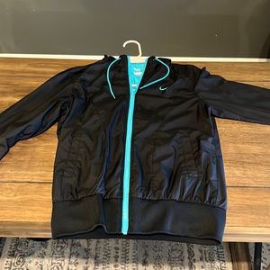 Women’s Medium Nike Zip up hoodie.